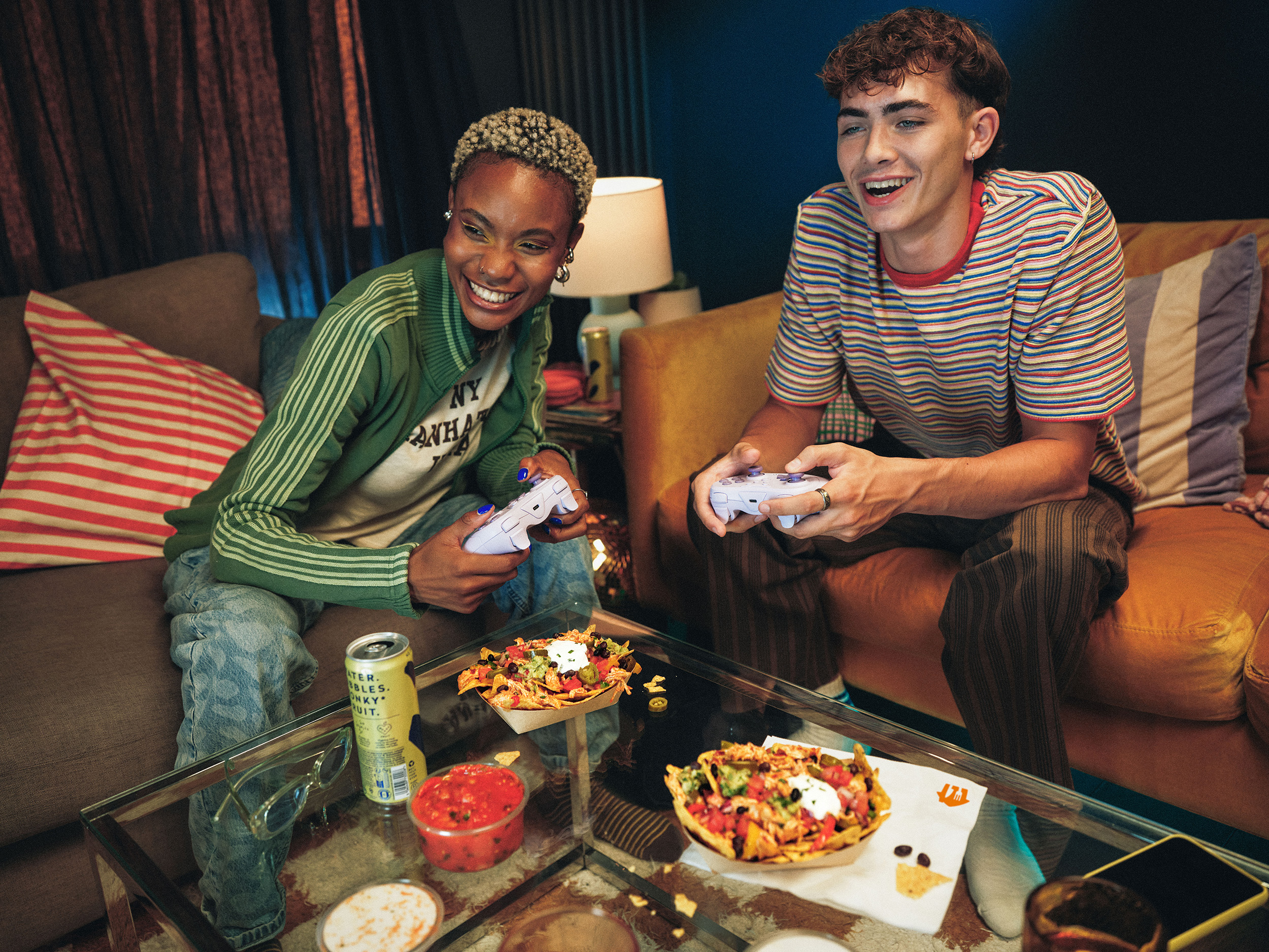 Lifestyle_sRGB_ALL_Late-Night-Nacho_Female-Male-Gaming-Laughing-Salsa_Model_EXP-AUG2030