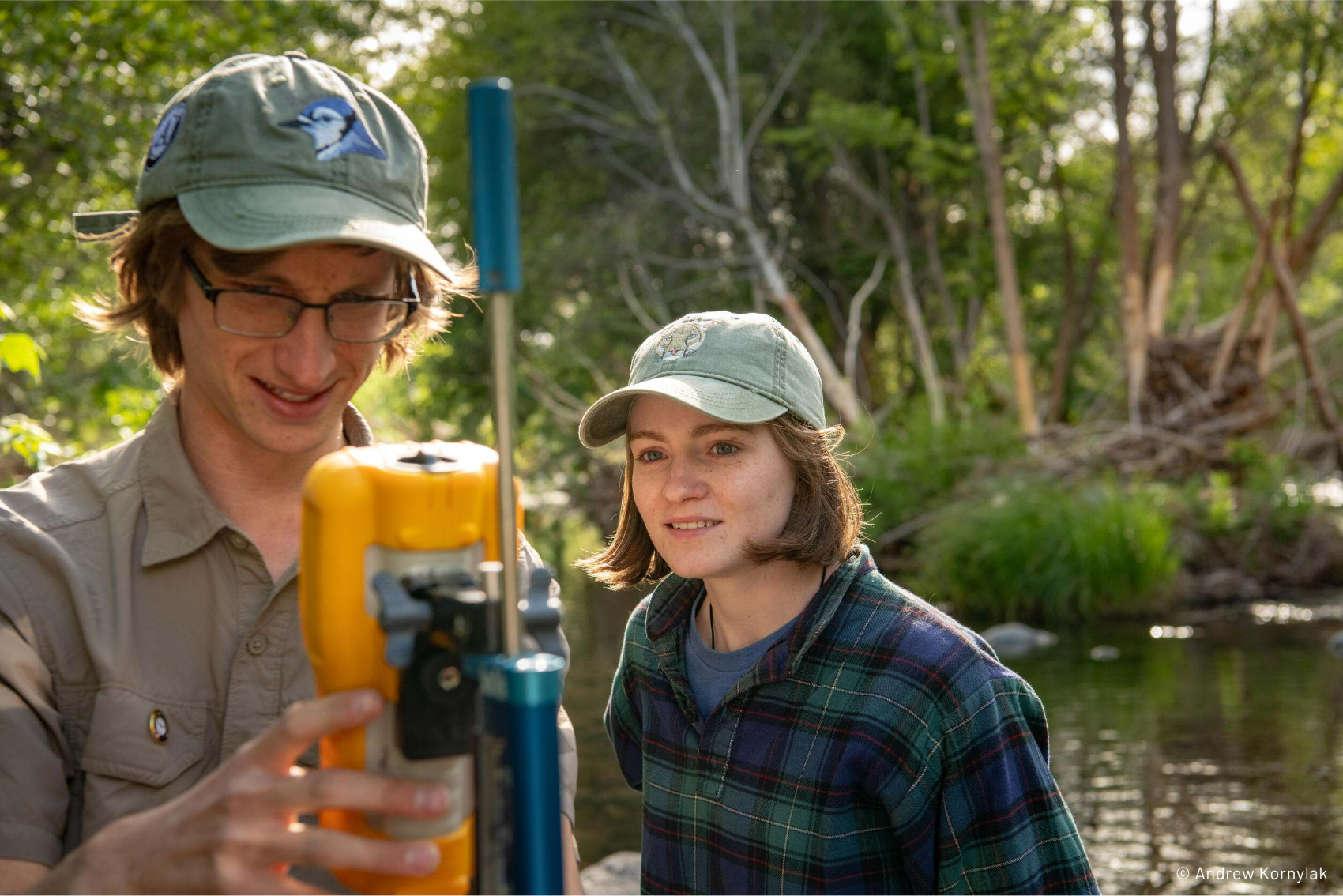 A couple of people reading a water sample device