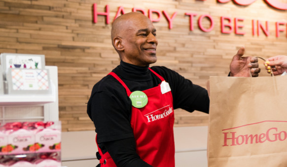 HomeGoods employee smiling and checking out customer