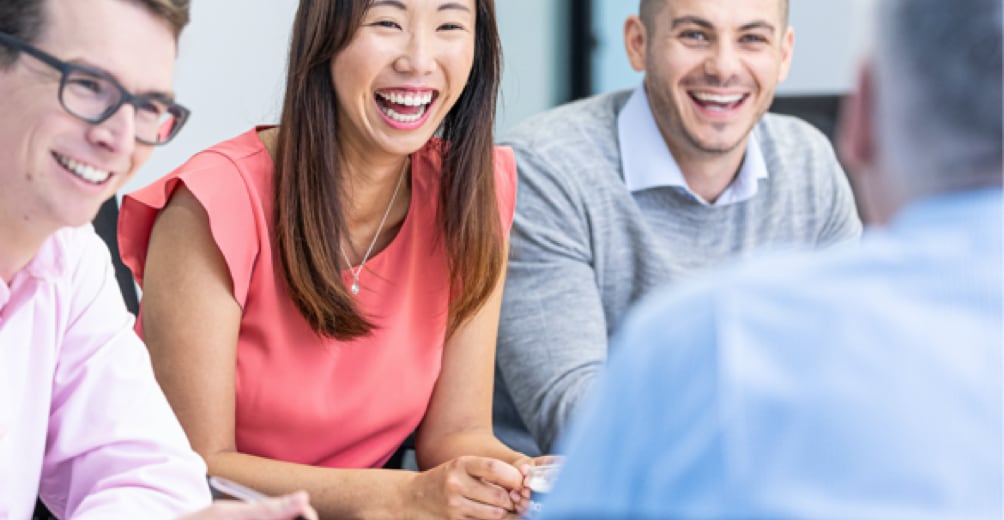 Business professionals smiling at camera