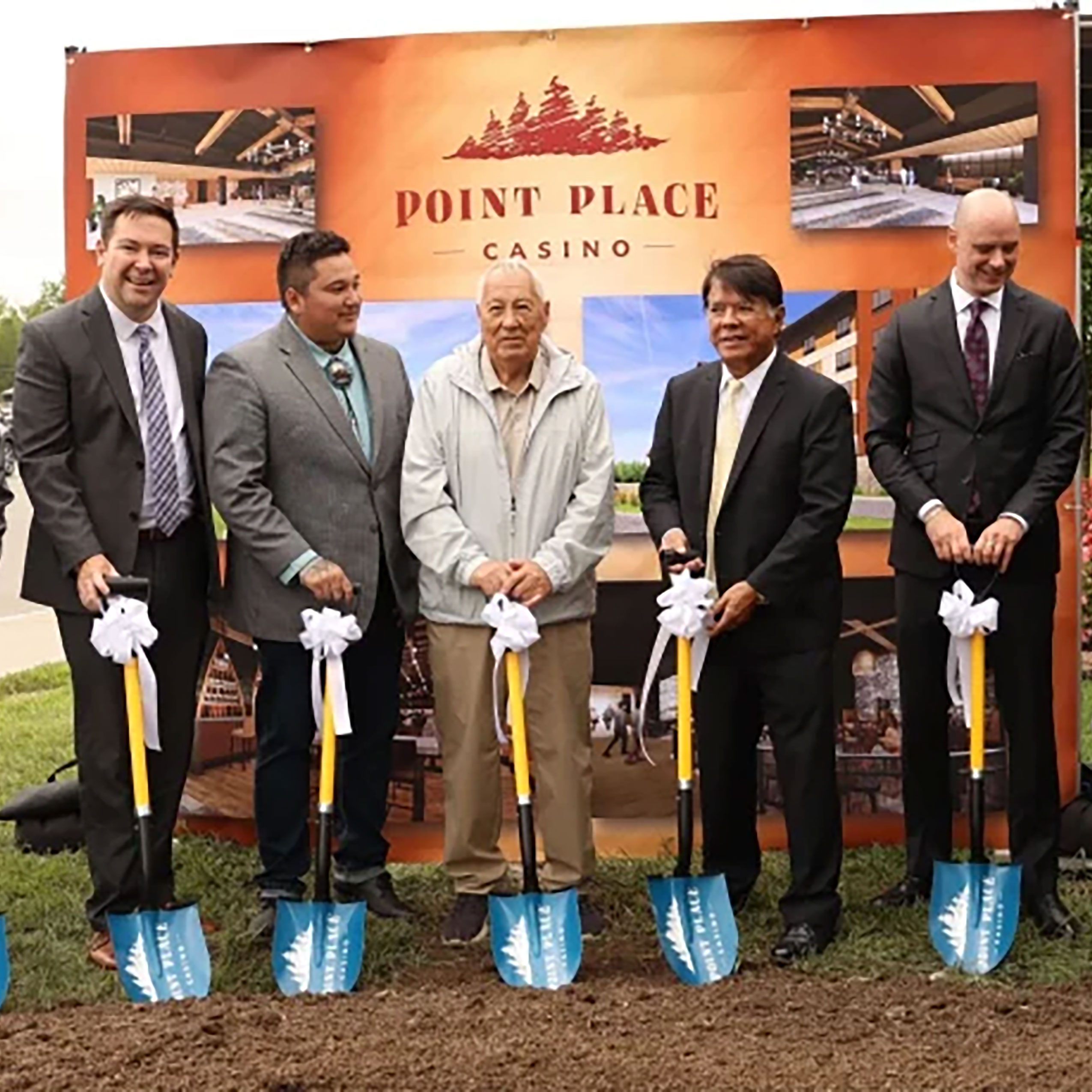 Leaders of Turning Stone Enterprises wearing suits and holding shovels to symbolize breaking ground on the renovations of Point Place Casino. 