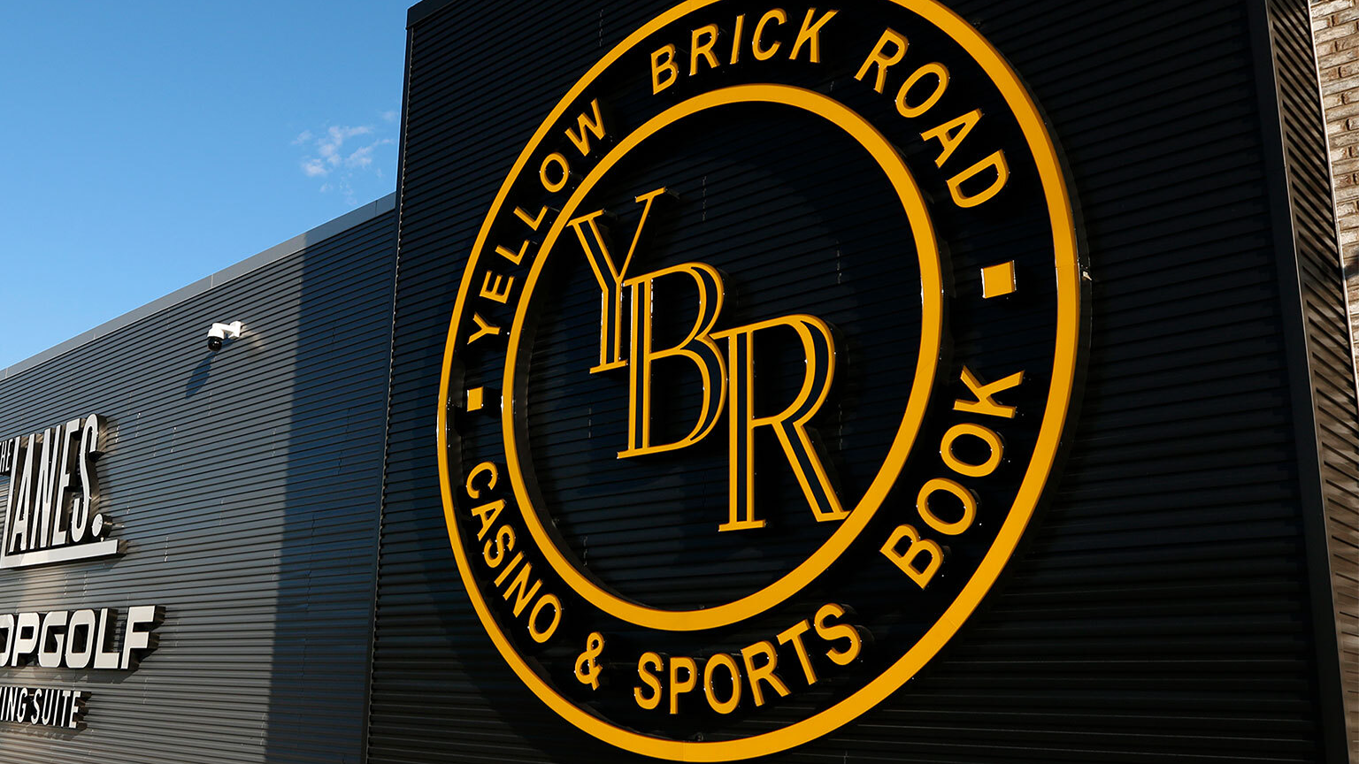 Yellow and black sign for Yellow Brick Road Casino and Sports Book. 