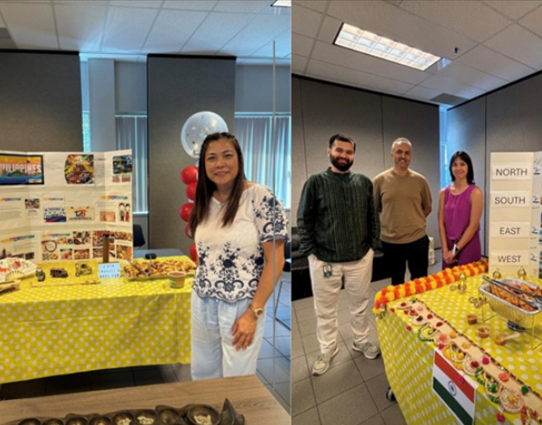 Co-workers standing in front of display boards that highlight different foods and cultures.