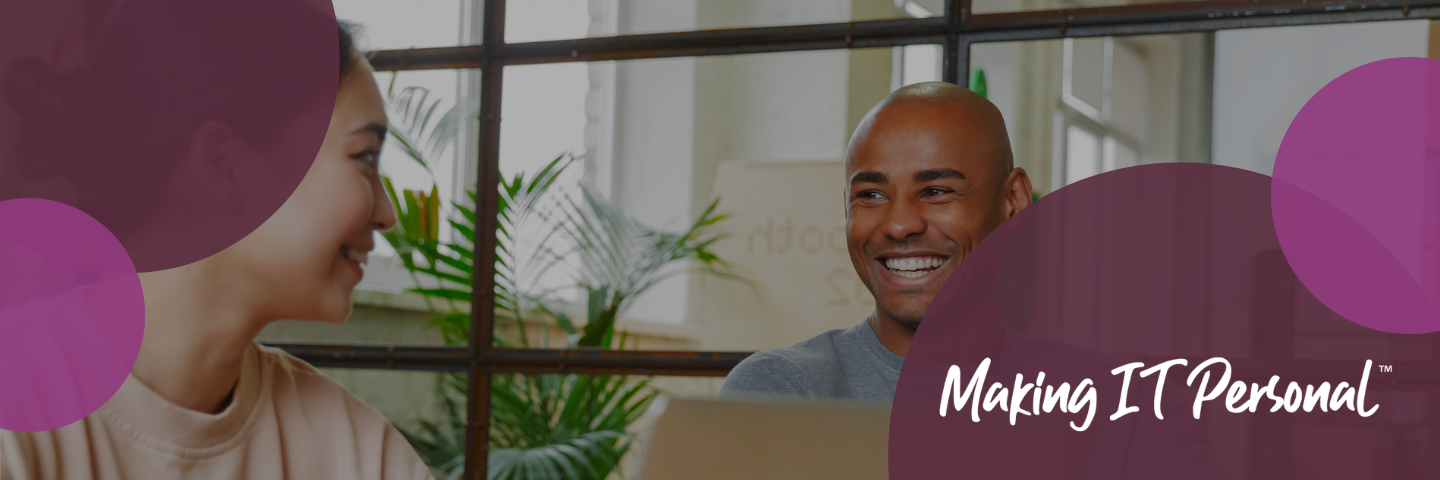 Two individuals smiling in an office with a border of purple circles