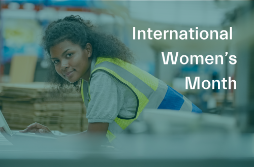 A woman in a safety vest working in a warehouse with the words, "International Women's Month."