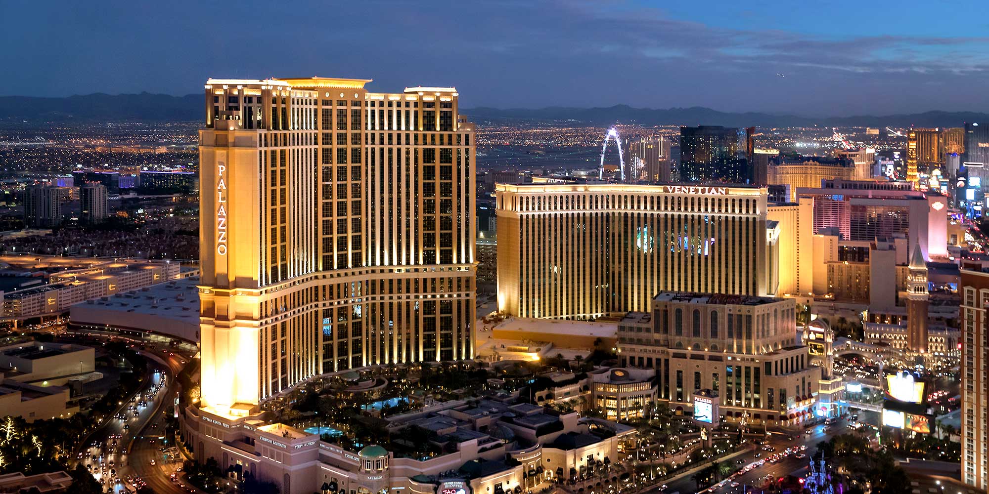 Aerial photograph of the hotel at dusk.