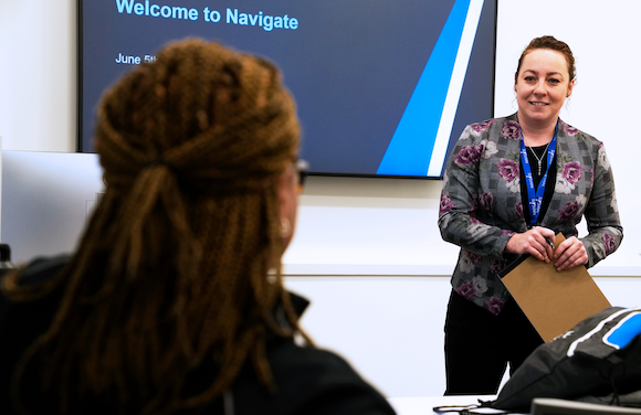 Smiling Navigate instructor engaging with participant