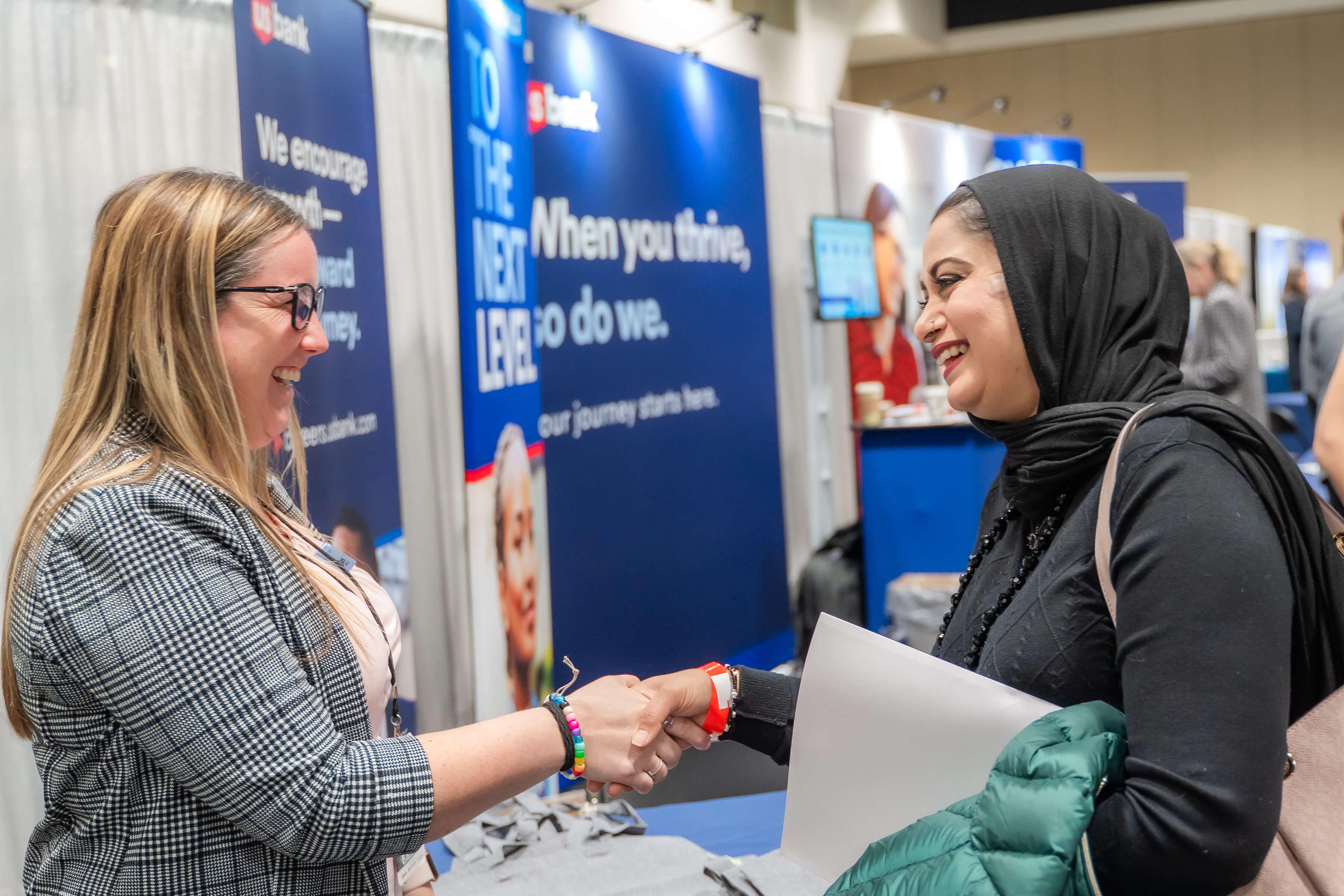 Two people shaking hands at career fair