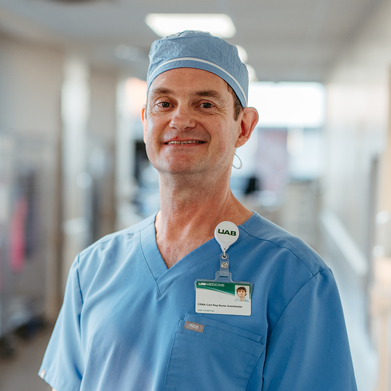White male standing and smiling