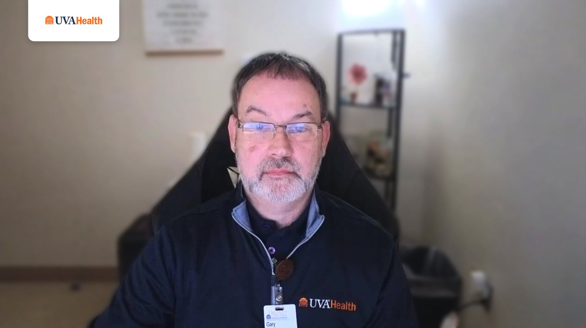 UVA Health team member in office setting looking at camera. 