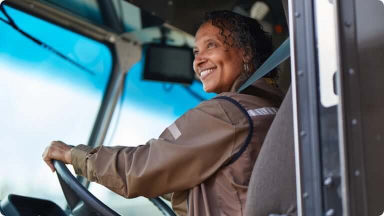 fast-facts-female-driving-ups-vehicle-smiling-m