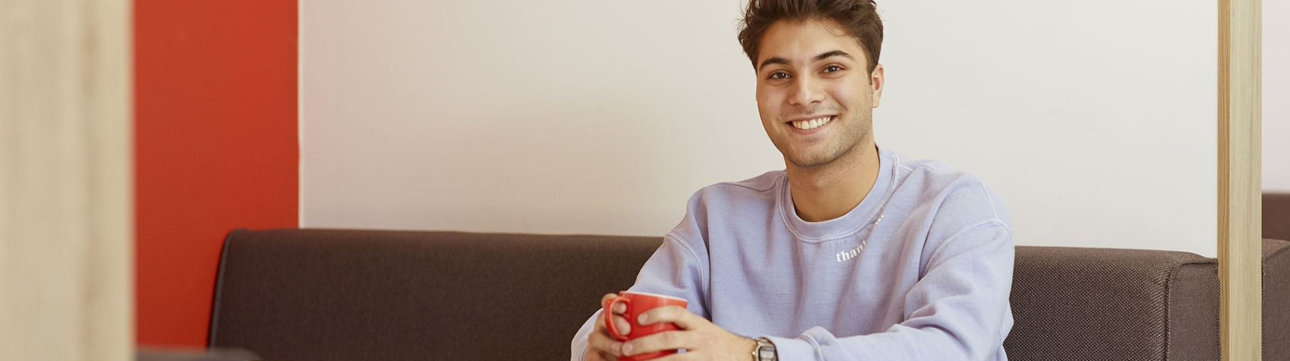 Verisure intern with coffee mug