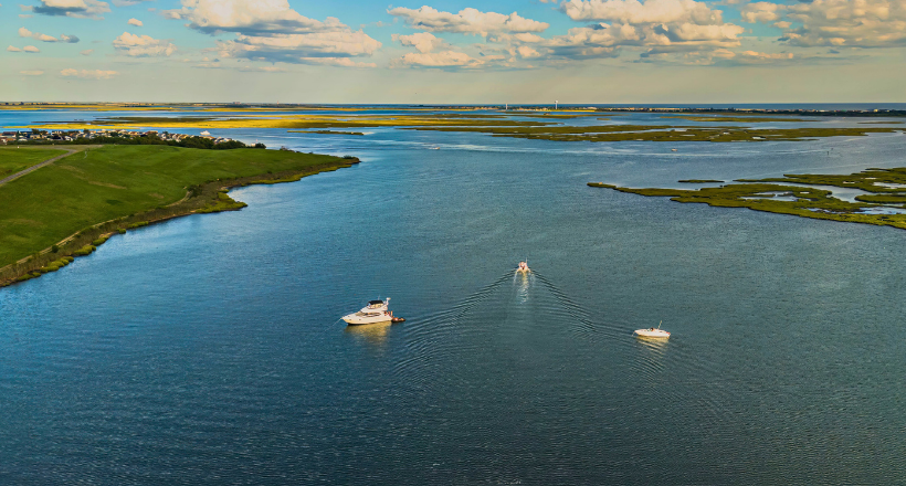 High angle aerial view over Island Park, Long Island, New York on a sunny day with blue skies.