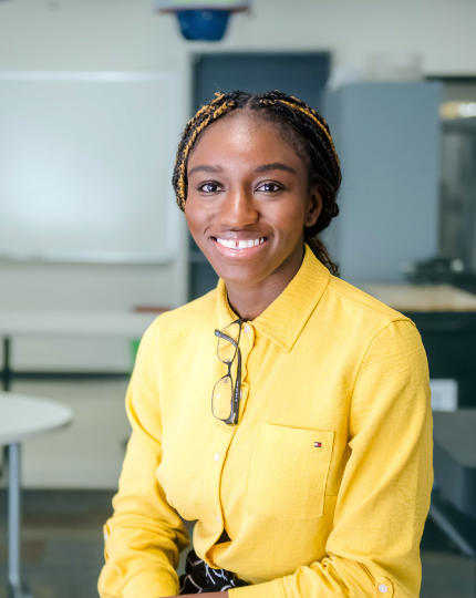 AJ, a systems engineer, smiles for a photo in the BIRST lab.