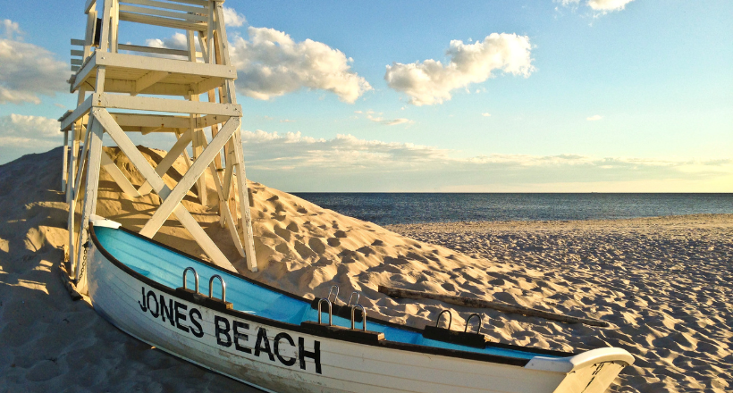 Lifeguard tower and a paddle boat on Jones Beach in Long Island, NY.