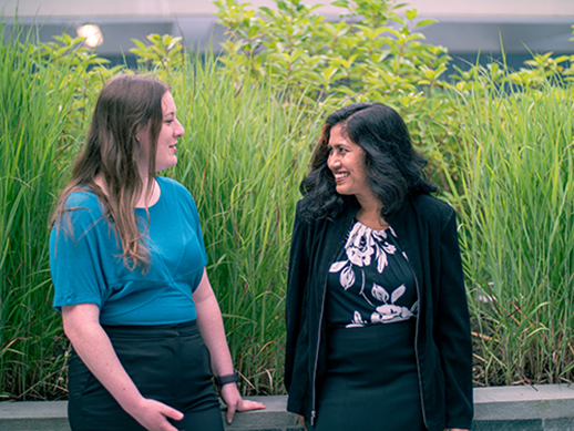 Two employees talking on their lunch break