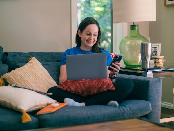  Employee working from home on their couch
