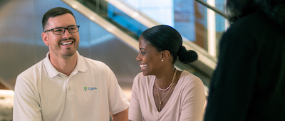 Employees sitting in a lobby talking
