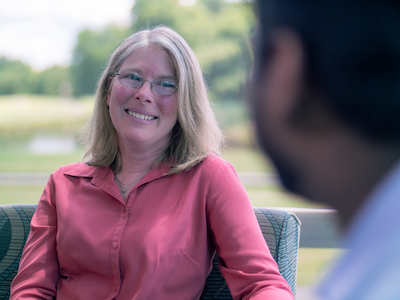 Employee smiling while in a discussion