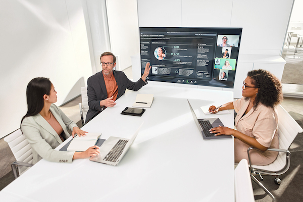 Coworkers smiling together in a conference room