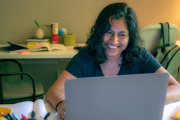 Female employee working from home on her laptop