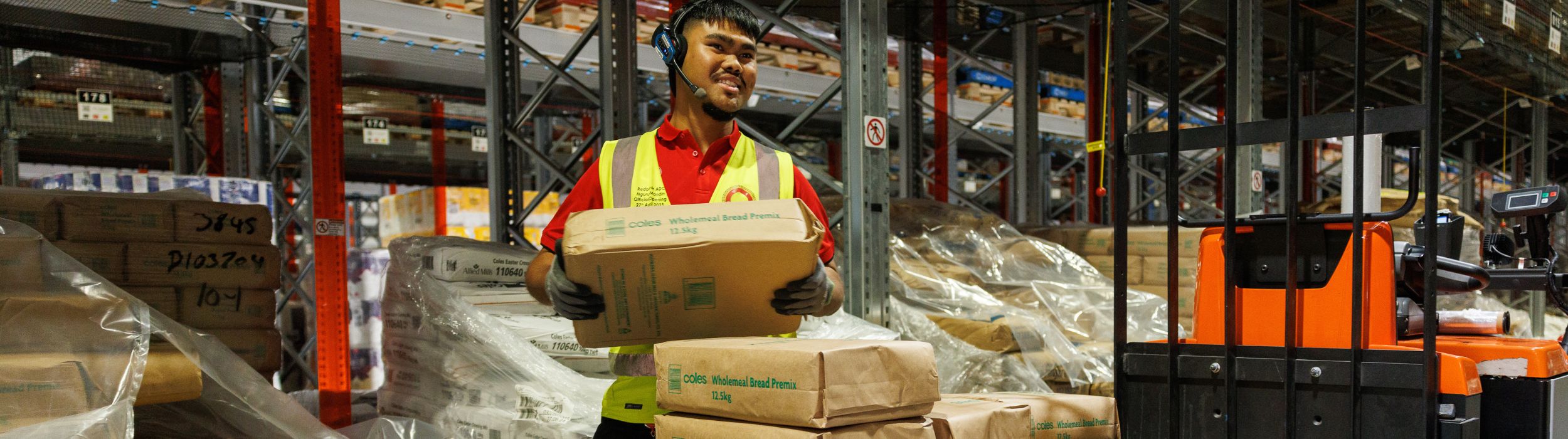 Male team member loading a forklift