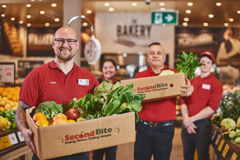 Coles team members with Second Bite crates full of produce