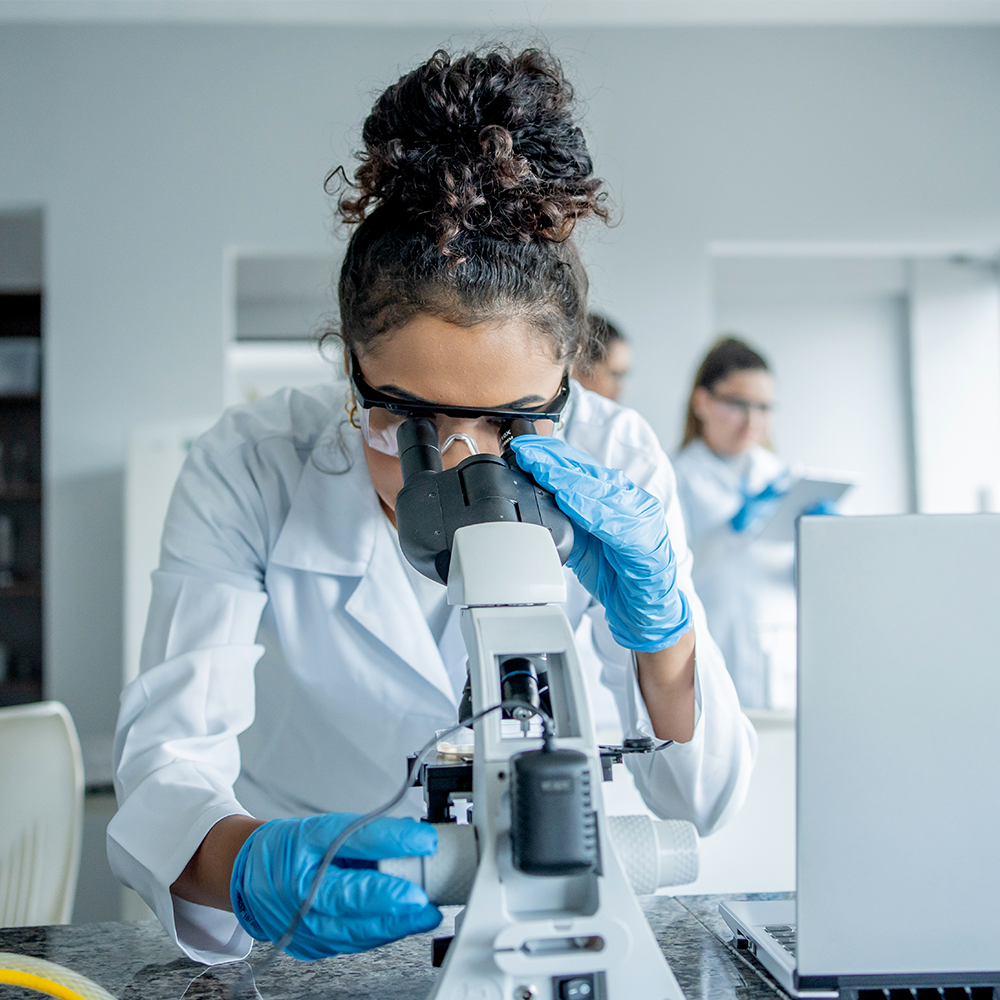 Close up of a female employee looking at equipment