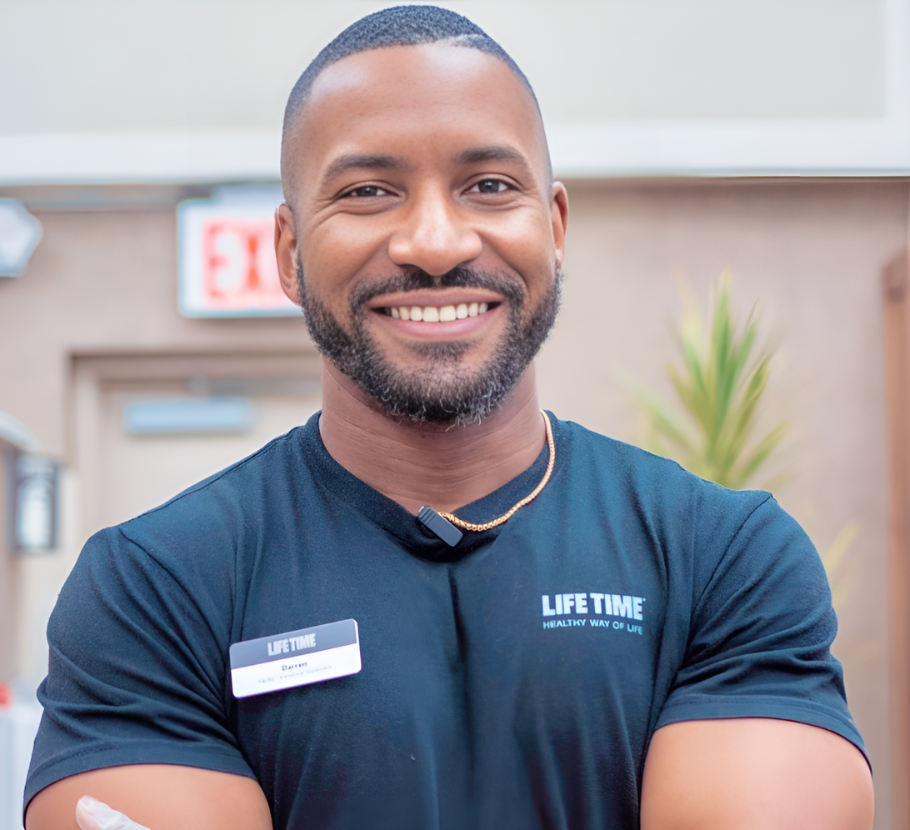 Male facility operations lead smiling at viewer.