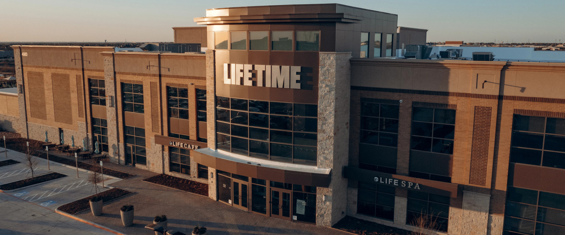 Front entrance of a Life Time club and then dives into aspects of building a healthy way of life at Life Time.