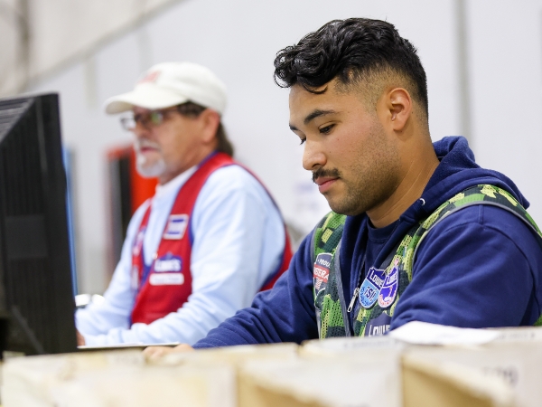 Supply Chain associates working at their computers in the distribution center