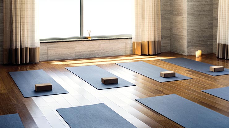 Life Time yoga studio set up for class with mats and yoga blocks.