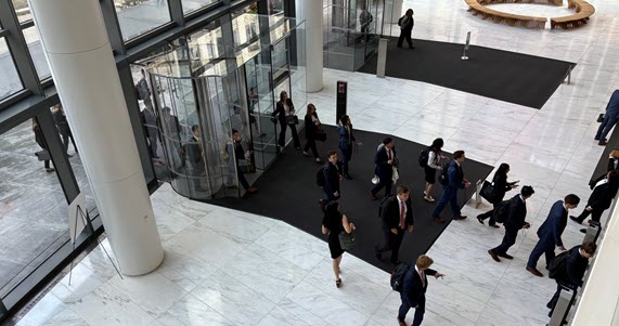 Four diverse college students in business professional attire.