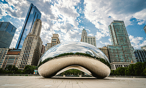 A picture of the Chicago Bean with the skyline in the background.