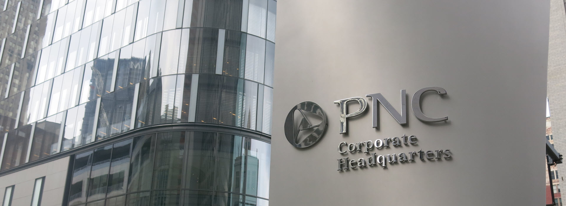 Picture of PNC's Corporate Headquarters sign in front of the PNC tower