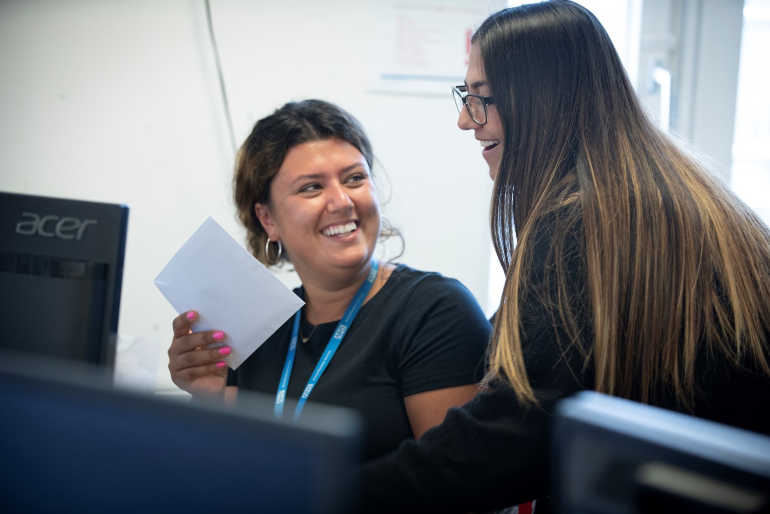 Colleagues smiling while working together