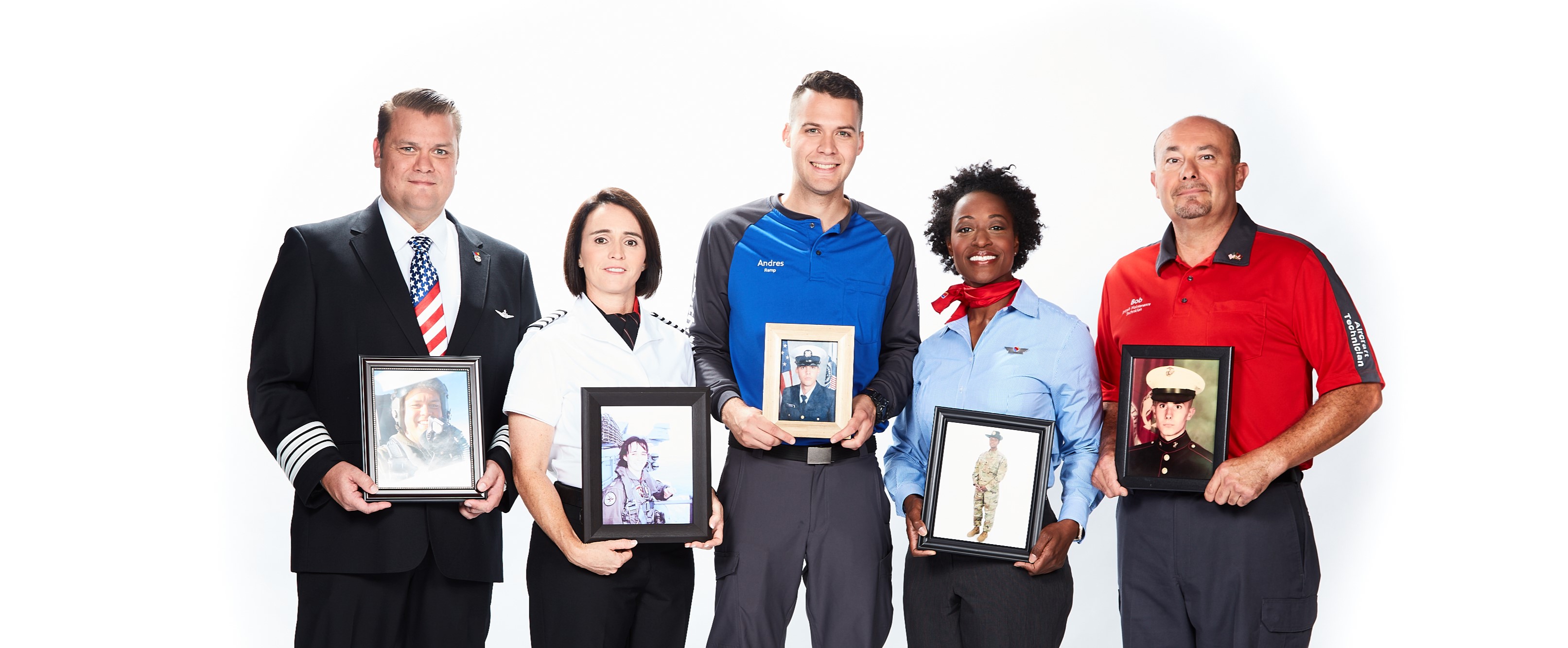5 uniformed Employees holding images of themselves in the military
