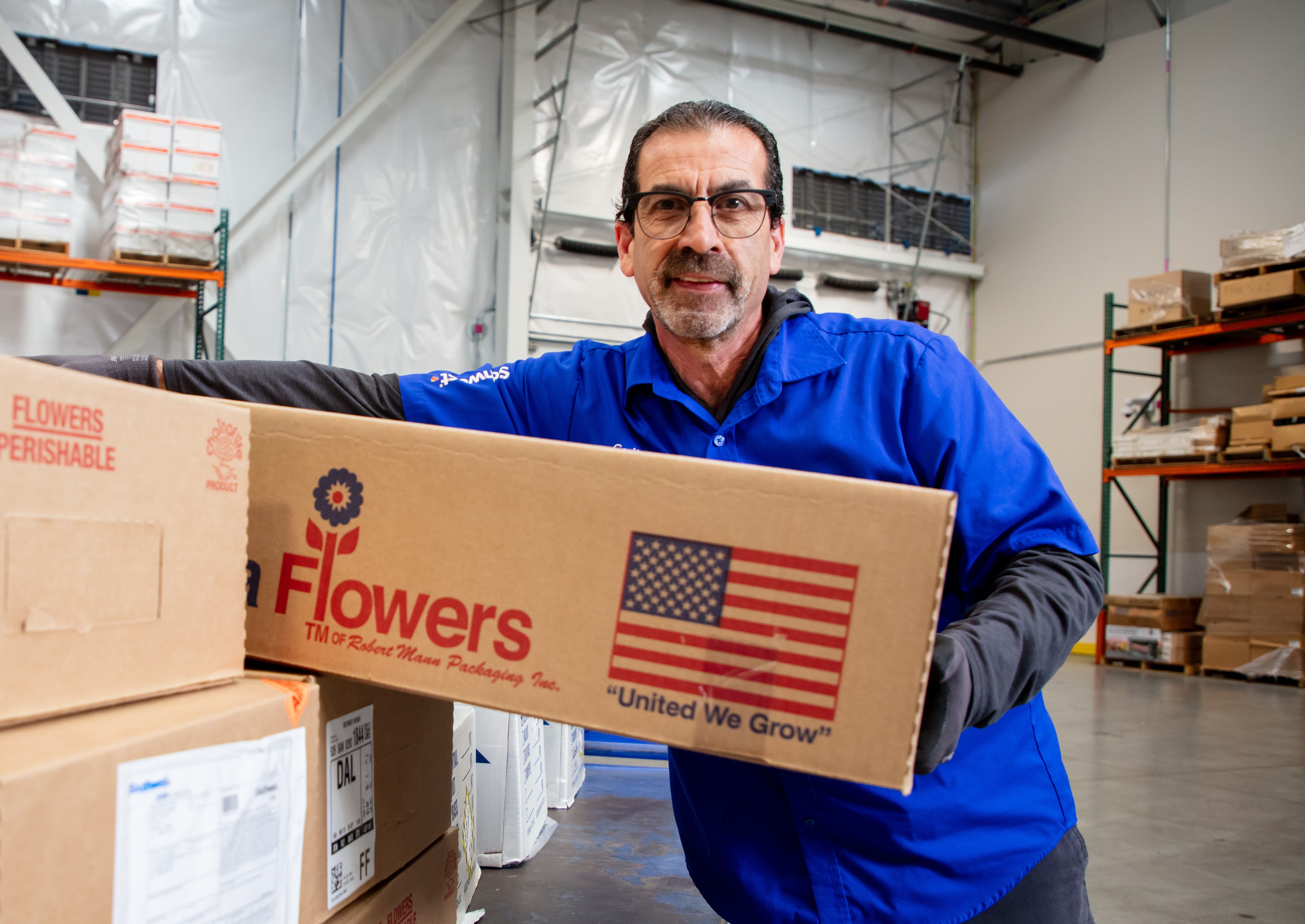 Cargo Agent smiling handling cargo.