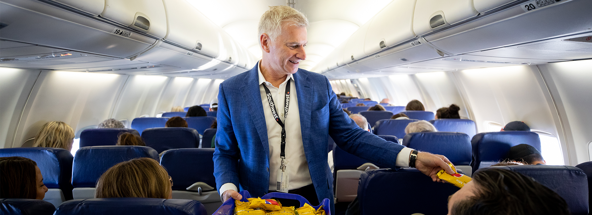 Southwest Airlines CEO Bob Jordan passing out snacks on a Southwest flight