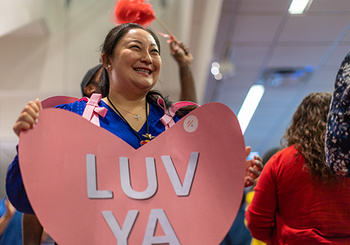 Southwest Employee wearing a heart the says "LUV YA"