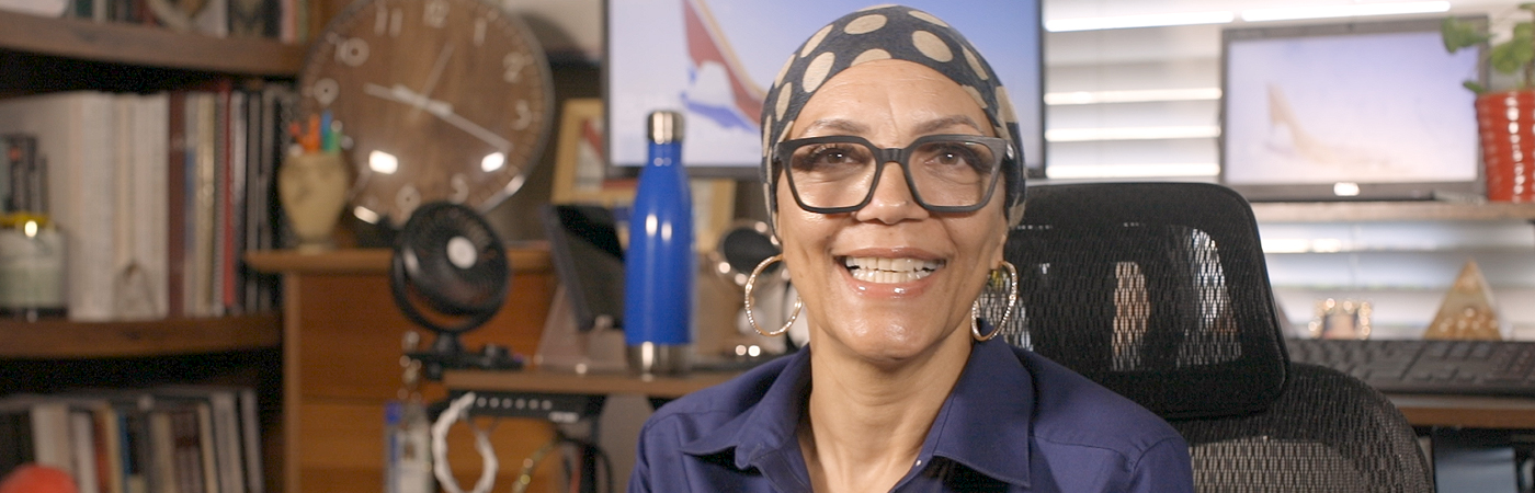 Southwest Airlines Customer Support & Services Employee smiling warmly in front of her remote work station