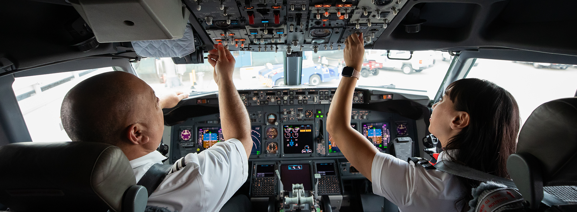 Southwest Pilots sitting in the flight deck turning knobs