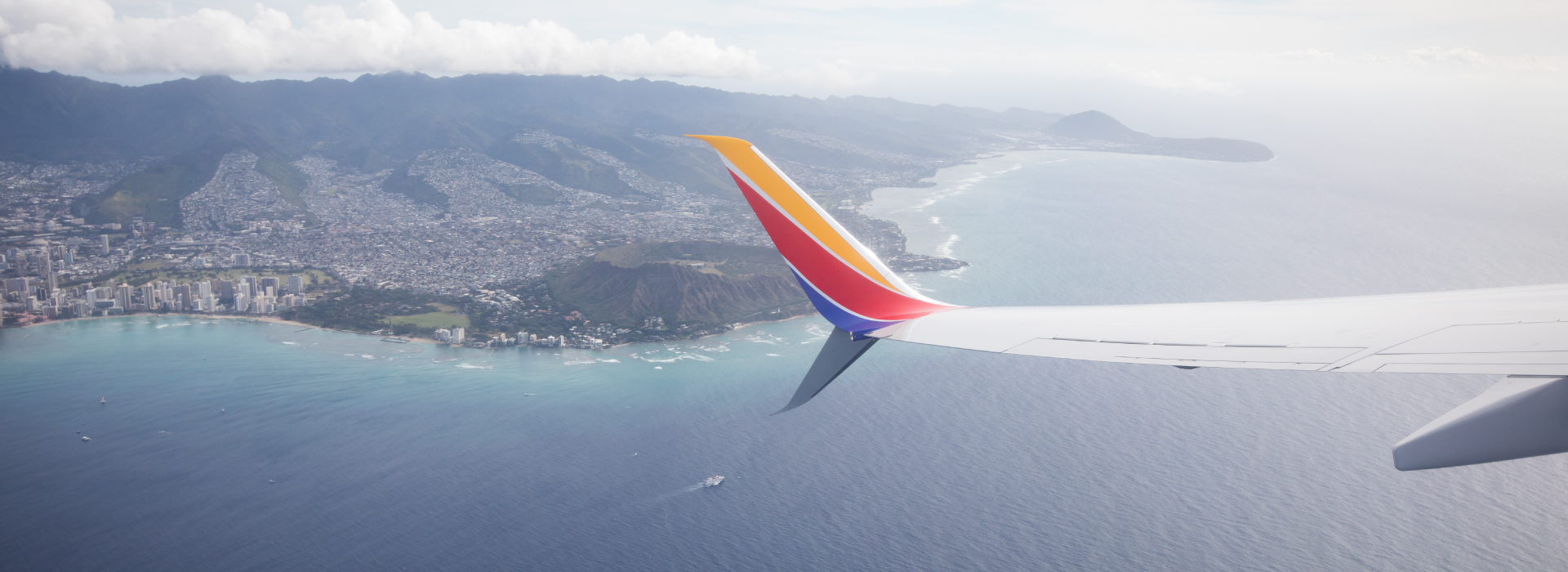 Southwest plane wing flying over the Hawaiian islands