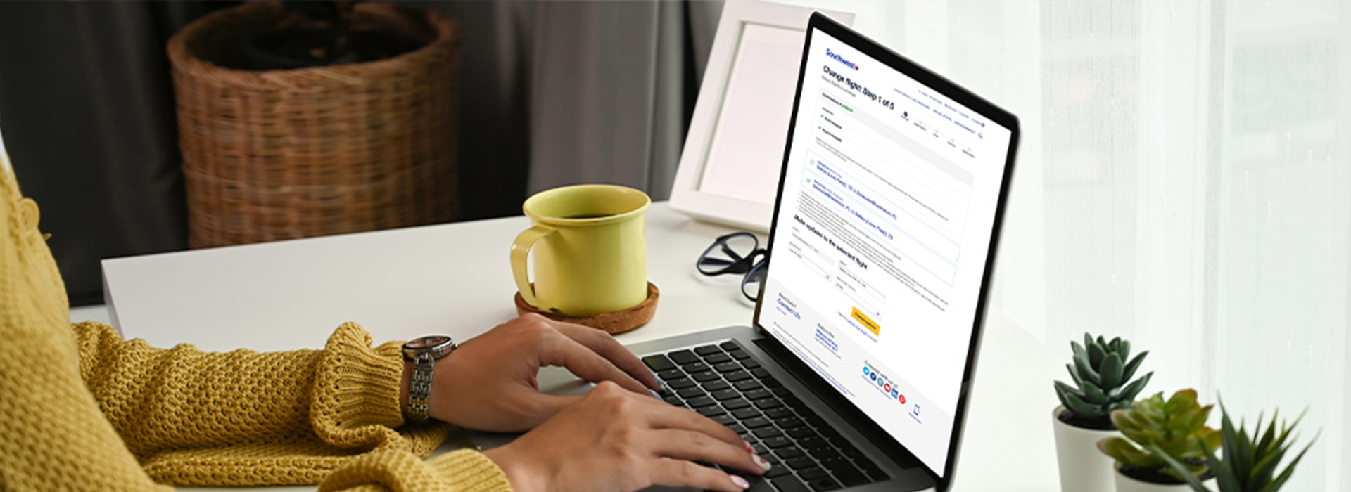A woman checking into her flight on a laptop