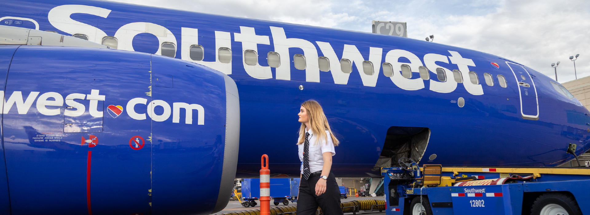 A pilot walking around a Southwest airplane