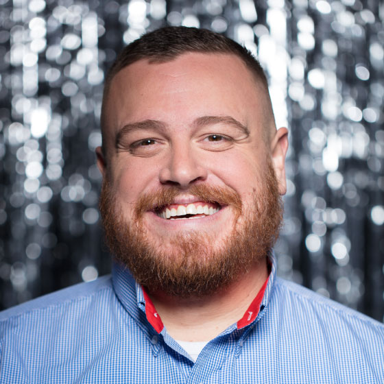 Headshot of VP of Ground Operations, Chris Johnson in front of a grey background. Chris started as a Ramp Agent in Detroit.