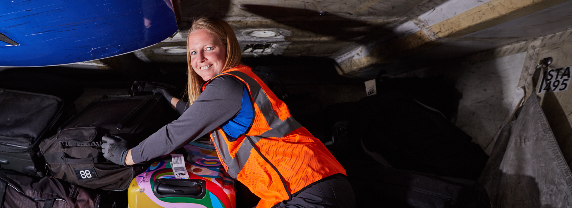 Southwest Ramp Agent loading bags onto a plane 