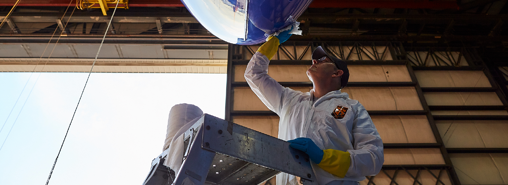 Appearance Technician cleaning an airplane wing