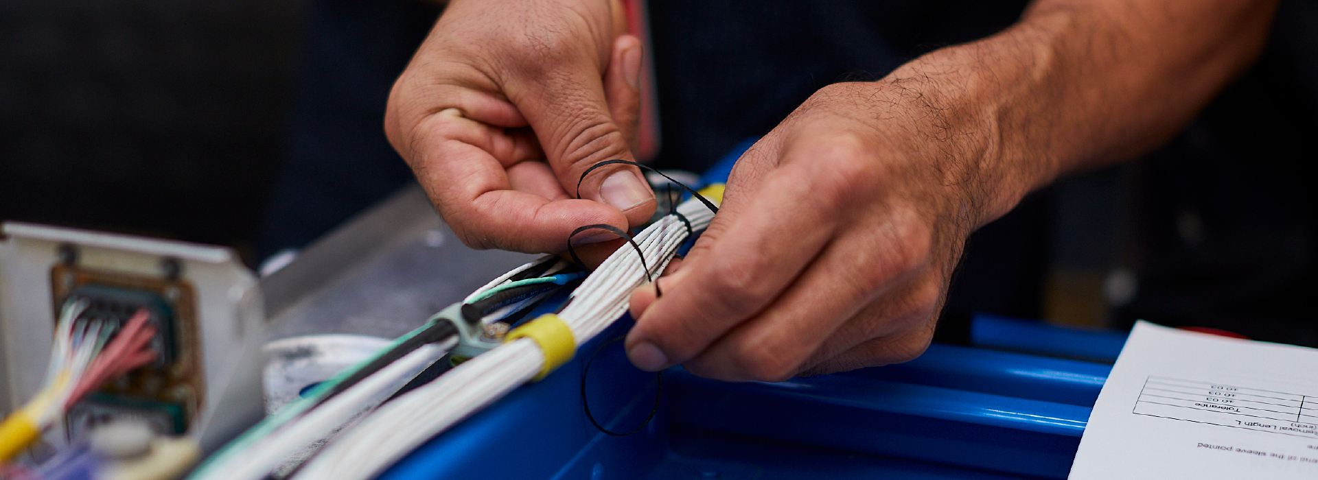 An engineer working on an airplane part