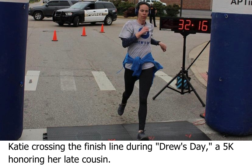 Katie crossing the finish line at "Drew's Day," a 5K honoring the life of her cousin.